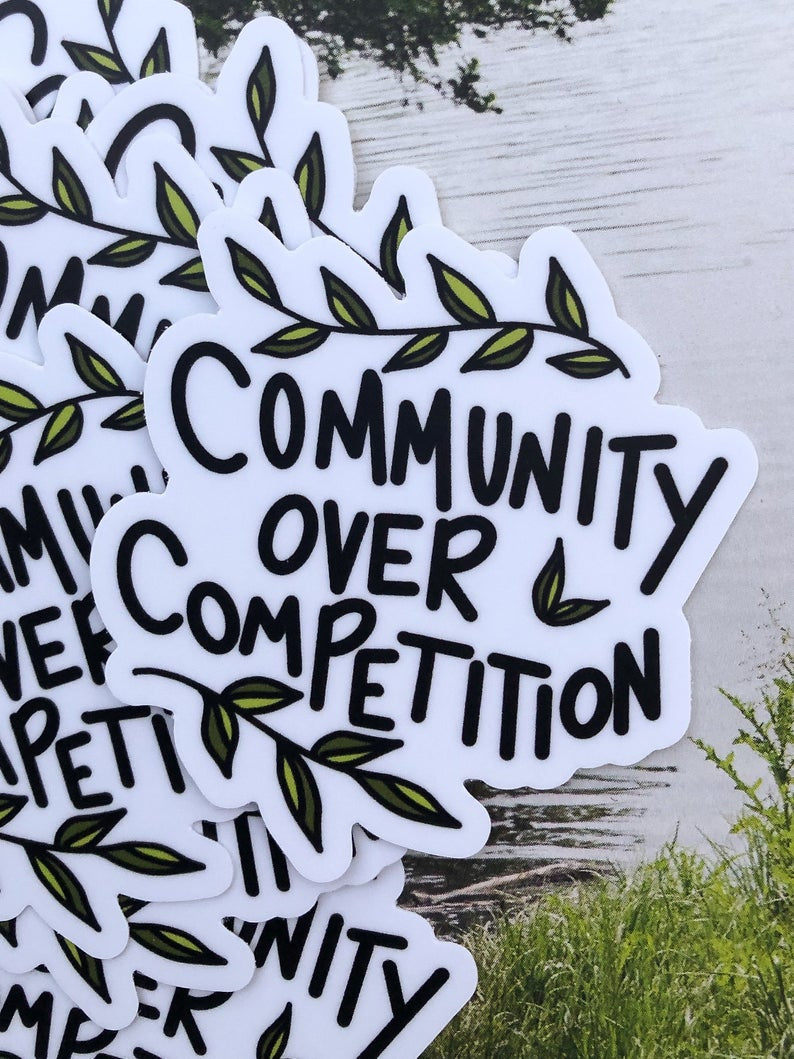 Community over competition sticker